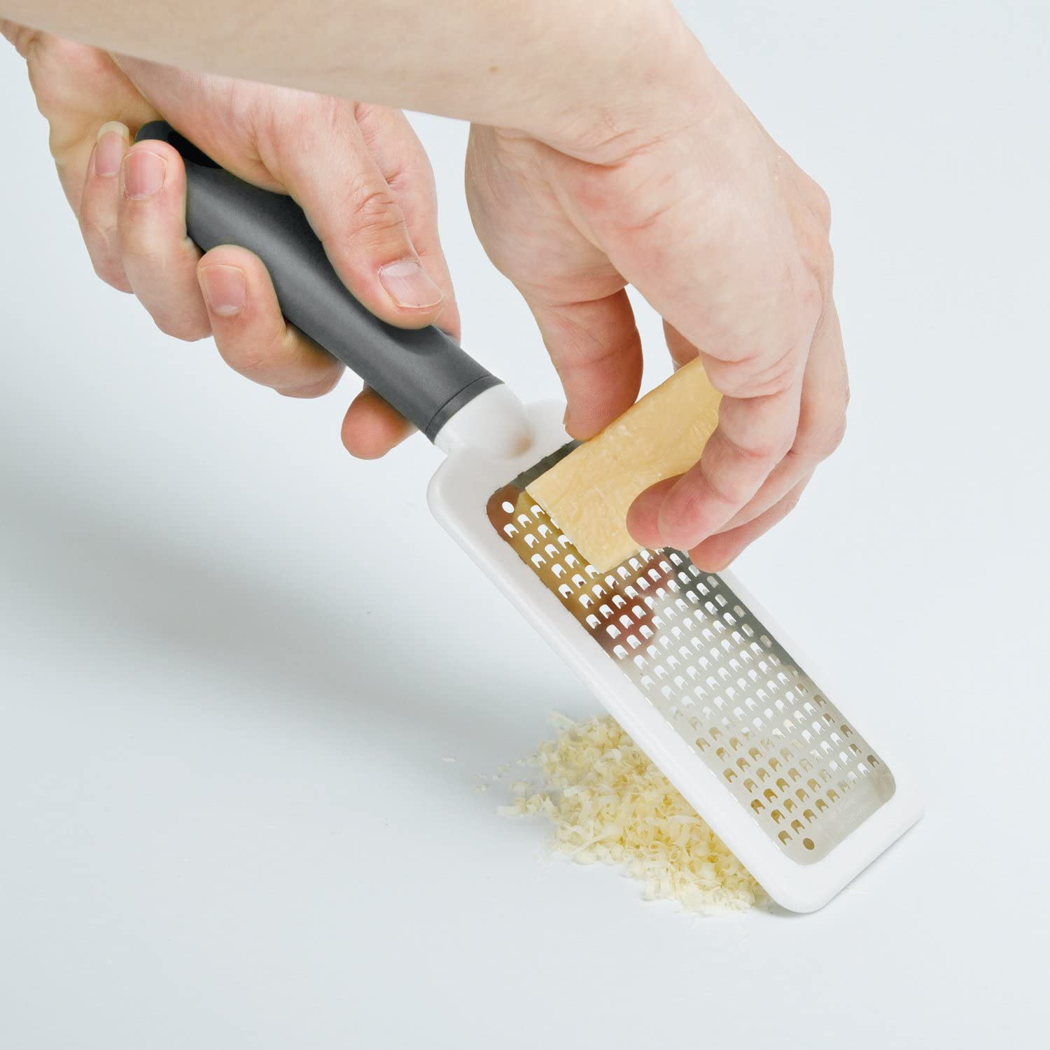  Rallador de plástico manual de mano para queso - Rallador de  plástico de cocina - Rallador de queso plano para manipulación manual :  Hogar y Cocina